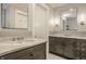 Elegant bathroom featuring double vanities with marble countertops and decorative mirrors at 3840 N Washington Blvd, Indianapolis, IN 46205