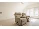Bonus room featuring neutral carpet, natural light, and two reclining chairs for relaxing or watching movies at 3840 N Washington Blvd, Indianapolis, IN 46205