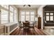 Breakfast room with tiled floors, large windows and view of the formal dining space at 3840 N Washington Blvd, Indianapolis, IN 46205