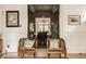 Dining room showcases chandelier lighting and a view through open doors to a dining space at 3840 N Washington Blvd, Indianapolis, IN 46205