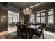 Charming dining room featuring a wooden table with chandelier and a view of patio dining at 3840 N Washington Blvd, Indianapolis, IN 46205