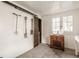 Clean garage interior with ample natural light, featuring storage solutions and a classic wooden floor at 3840 N Washington Blvd, Indianapolis, IN 46205
