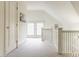 Bright hallway featuring white trim, neutral carpet, a storage closet, and a window seat overlooking the neighborhood at 3840 N Washington Blvd, Indianapolis, IN 46205