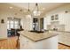Bright eat-in kitchen with bar stool seating and seamless access to the dining area at 3840 N Washington Blvd, Indianapolis, IN 46205