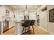 Modern kitchen featuring an island with seating, stainless appliances, and ample storage at 3840 N Washington Blvd, Indianapolis, IN 46205