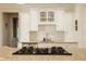 Bright eat-in kitchen features white backsplash, custom white cabinets, and granite countertops at 3840 N Washington Blvd, Indianapolis, IN 46205