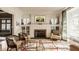 Cozy living room with a fireplace, built-in cabinets, and stylish seating arrangement at 3840 N Washington Blvd, Indianapolis, IN 46205