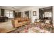 Spacious living room with hardwood floors, a comfortable sofa, and decorative rug at 3840 N Washington Blvd, Indianapolis, IN 46205
