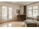 Bright living room featuring French doors, hardwood floors, and cozy seating with natural light at 3840 N Washington Blvd, Indianapolis, IN 46205