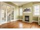 Inviting living room showcasing hardwood floors, a decorative fireplace, and natural light at 3840 N Washington Blvd, Indianapolis, IN 46205
