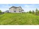 Expansive backyard with well-maintained lawn, black metal fence, and ample space for outdoor activities at 4061 Secretariat Ln, Bargersville, IN 46106