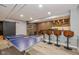 Spacious basement featuring a ping pong table, bar, and foosball at 4061 Secretariat Ln, Bargersville, IN 46106
