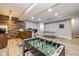 Finished basement with a foosball table and bar area at 4061 Secretariat Ln, Bargersville, IN 46106