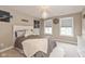 Bedroom with a full bed and a view of the neighborhood outside at 4061 Secretariat Ln, Bargersville, IN 46106