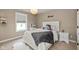 Bright bedroom featuring a full bed, white furniture, and a window with a view of the community at 4061 Secretariat Ln, Bargersville, IN 46106