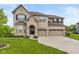Charming two-story brick home with three-car garage and well-manicured lawn at 4061 Secretariat Ln, Bargersville, IN 46106