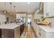 Modern kitchen featuring white cabinets, stainless steel appliances, and a spacious island with seating at 4061 Secretariat Ln, Bargersville, IN 46106