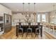 Bright, open kitchen with a large island, stainless steel appliances, and modern pendant lighting fixtures at 4061 Secretariat Ln, Bargersville, IN 46106
