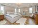 Tranquil main bedroom featuring neutral tones, recessed lighting, a tray ceiling, and large windows at 4061 Secretariat Ln, Bargersville, IN 46106