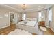 Bright main bedroom with large bed, tray ceiling, ensuite bathroom and plenty of natural light at 4061 Secretariat Ln, Bargersville, IN 46106