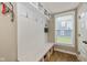 Mudroom with a built-in bench, coat hooks, storage and a window with natural light at 4061 Secretariat Ln, Bargersville, IN 46106