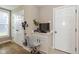 Cozy office nook with a small desk, chair, and storage cabinets near the entryway of the home at 4061 Secretariat Ln, Bargersville, IN 46106