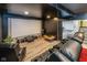 Home theater room with reclining seats and a large screen at 4061 Secretariat Ln, Bargersville, IN 46106