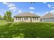 Well-manicured lawn in the backyard, featuring views of the home's rear exterior at 4125 Sugar Pine Ln, Zionsville, IN 46077