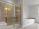 Modern bathroom featuring a shower, tub, and double sinks at 4125 Sugar Pine Ln, Zionsville, IN 46077