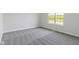 Bright bedroom with a large window and neutral-toned carpeting at 4125 Sugar Pine Ln, Zionsville, IN 46077