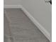 Close-up of the neutral colored carpeting and white base trim at 4125 Sugar Pine Ln, Zionsville, IN 46077