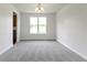 Dining room features an elegant chandelier and a large window at 4125 Sugar Pine Ln, Zionsville, IN 46077