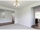 Dining room features an elegant chandelier and views of the kitchen at 4125 Sugar Pine Ln, Zionsville, IN 46077