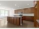 Bright kitchen featuring a large island and updated appliances at 4125 Sugar Pine Ln, Zionsville, IN 46077