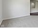 Bright living room with neutral-toned carpeting at 4125 Sugar Pine Ln, Zionsville, IN 46077