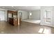 Open-concept living room flowing from the kitchen and featuring a door to an outdoor area at 4125 Sugar Pine Ln, Zionsville, IN 46077