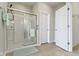 Modern bathroom featuring a glass-enclosed shower with sleek fixtures and neutral-toned flooring at 4181 Gordman Dr, Whitestown, IN 46075