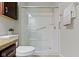 Bright bathroom showcasing a glass-enclosed shower with white subway tile and grab bar at 4181 Gordman Dr, Whitestown, IN 46075