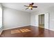 Primary bedroom boasting hardwood floors, neutral walls, and a ceiling fan at 4181 Gordman Dr, Whitestown, IN 46075