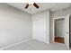This bedroom boasts a ceiling fan, carpet, and a closet for storage, along with neutral paint at 4181 Gordman Dr, Whitestown, IN 46075