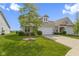 Inviting exterior elevation of a single-Gathering home with a well-manicured lawn and an attached two-car garage at 4181 Gordman Dr, Whitestown, IN 46075