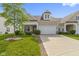 Inviting exterior elevation of a single-Gathering home with a well-manicured lawn and an attached two-car garage at 4181 Gordman Dr, Whitestown, IN 46075