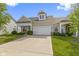 Inviting exterior elevation of a single-Gathering home with a well-manicured lawn and an attached two-car garage at 4181 Gordman Dr, Whitestown, IN 46075
