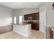 Spacious kitchen featuring an island with sink, granite countertops, and stainless steel appliances at 4181 Gordman Dr, Whitestown, IN 46075
