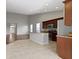 Open concept kitchen with an island, stainless steel appliances, and dark brown cabinets at 4181 Gordman Dr, Whitestown, IN 46075