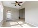 Bright living room featuring tile floor, neutral paint, ceiling fan, and lots of natural light at 4181 Gordman Dr, Whitestown, IN 46075
