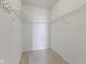 An empty walk-in closet space with carpeted floors and metal shelving along the top of the walls at 4181 Gordman Dr, Whitestown, IN 46075