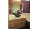 Bathroom featuring a unique black bowl sink, wood vanity, and large mirror at 4288 Silver Hill Dr, Greenwood, IN 46142