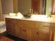 Bathroom vanity with black stone sink and hardwood cabinet at 4288 Silver Hill Dr, Greenwood, IN 46142