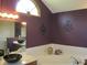Bathroom featuring a black vessel sink, soaking tub, and modern decor accents at 4288 Silver Hill Dr, Greenwood, IN 46142